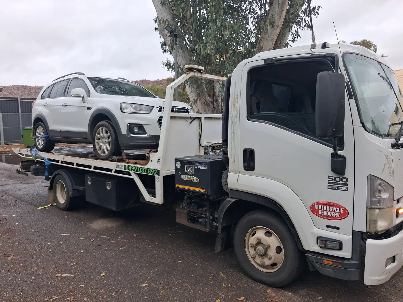 A white Holden Captiva on A.R Towing's Isuzu tilt tray